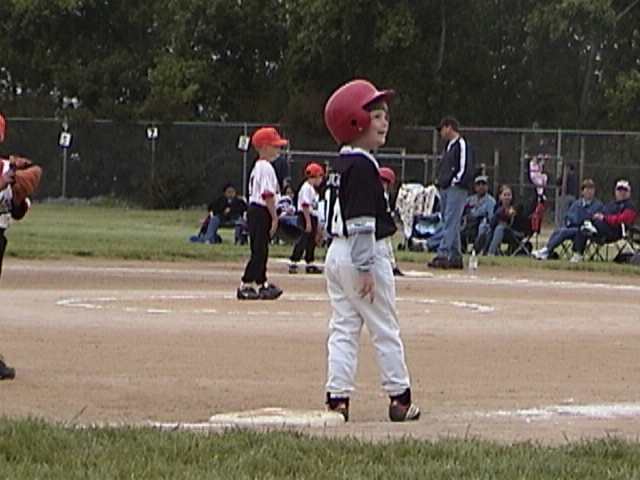Offense or defense, Doug's favorite pasttime at third is to chat up the third base coach.