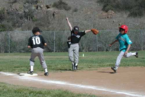 Doug, backing up at shortstop, celebrates an out at third.