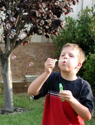 Doug blowing some of Aunt Judy's bubbles