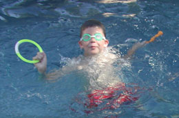 Doug putting his swim lessons to work at the pool party