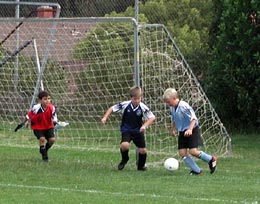 Doug defends as fullback in front of his own goal