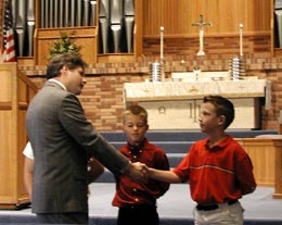 Rev. Suggs welcomes Brad to the church