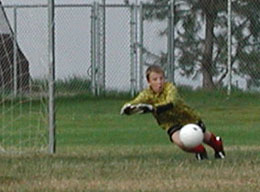 Brad can't quite get to this ball, but his geometry is flawless as the shot goes wide