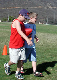Austin and Doug in the balloon relay at the Induction Picnic.
