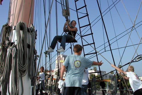Brad directs his crew of boatswains to lift the chair